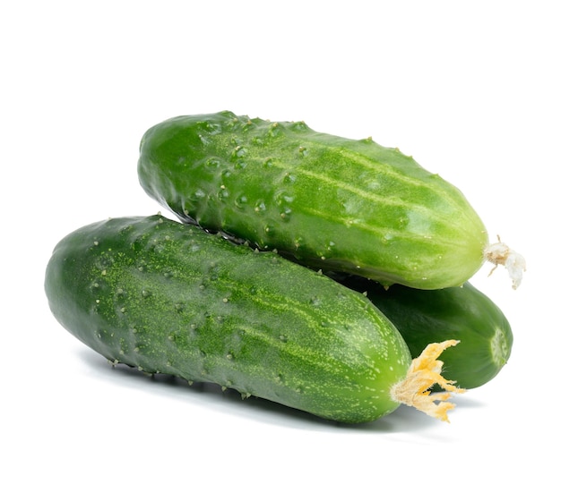 Bunch of ripe green cucumbers on a white isolated background