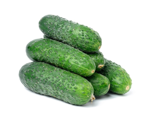 Bunch of ripe green cucumbers on a white isolated background