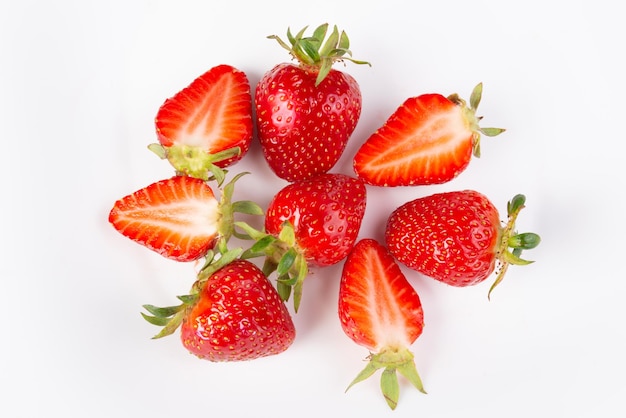 A bunch of ripe strawberries on a white background closeup