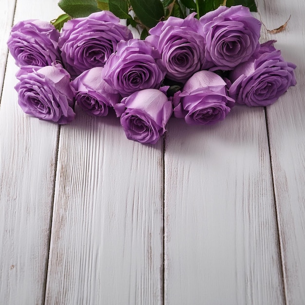 bunch of roses on wooden table