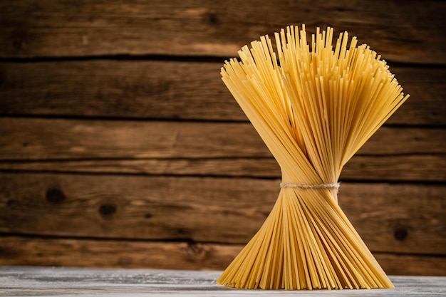 A bunch of spaghetti dry tied with a rope