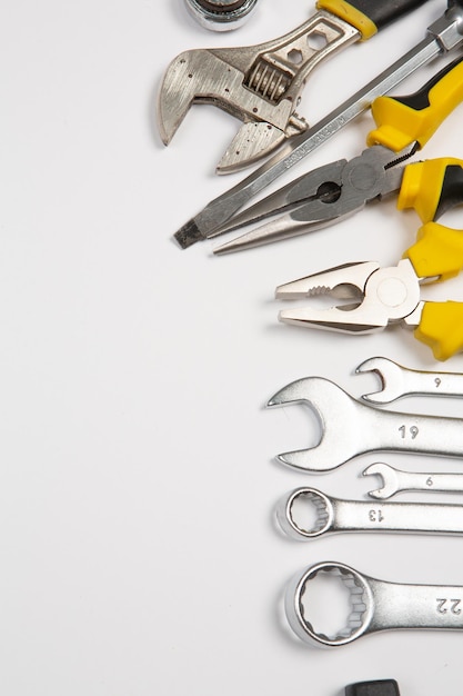 A bunch of tools including a wrench, one of which is labeled 19.