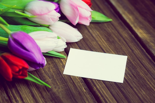 Bunch of tulips and white card