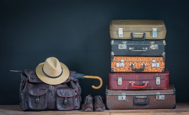 a bunch of vintage leather suitcases