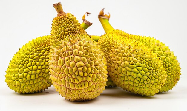 Photo a bunch of yellow fruit that is on a white background