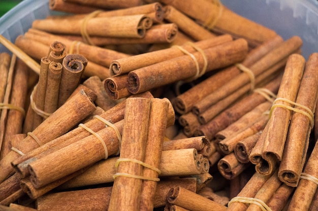 Bunches of cinnamon sticks in a herbal shop