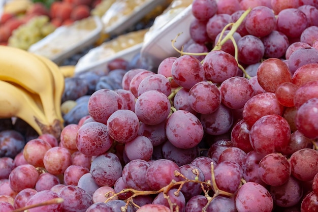 Bunches of juicy red grapes on counter Horizontal photo