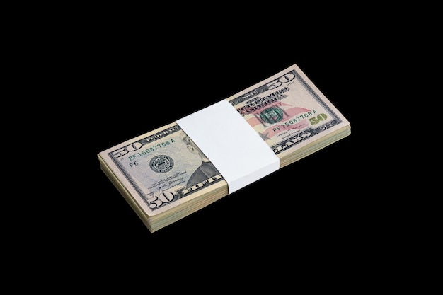 Bundle of US dollar bills isolated on black Pack of american money with high resolution on perfect black background