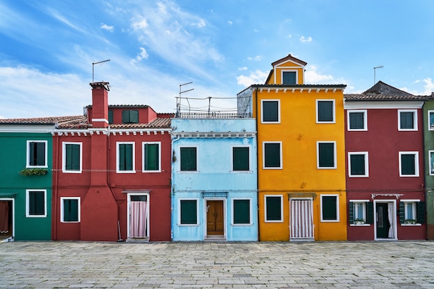 Burano, Venice. Old colorful houses architecture at the square. Italy. Cloudy weather