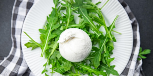 buratta salad arugula green leaves cheese burratina healthy meal food snack on the table copy space