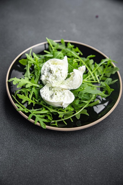 buratta salad arugula green leaves cheese burratina healthy meal food snack on the table copy space