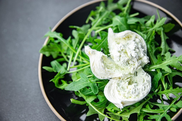 buratta salad green leaves arugula cheese burratina healthy meal food snack on the table copy space