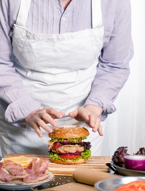 Burger cheeseburger hamburger big chif cook cooking white background home