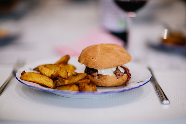 Burger and fries in a plate