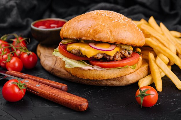 Burger hamburger with french fries cutting board