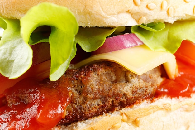 Burger with cutlet tomato cheese and greens Fresh tasty burger isolated on black background Classic Burger close up