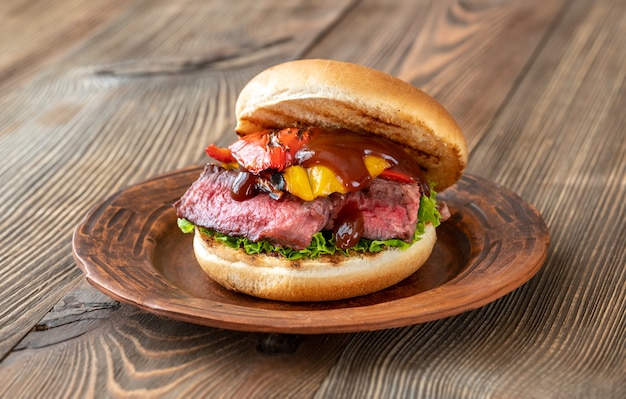 Burger with grilled steak and bell peppers