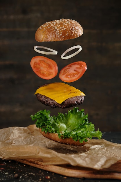 Burger with pattie and latus tomato cheese slice