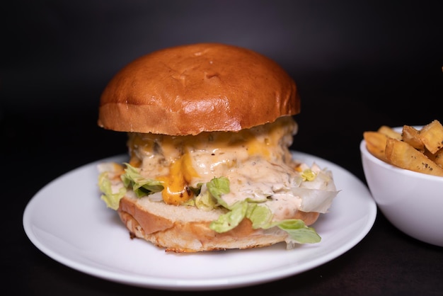 A burger with a side of fries on a plate