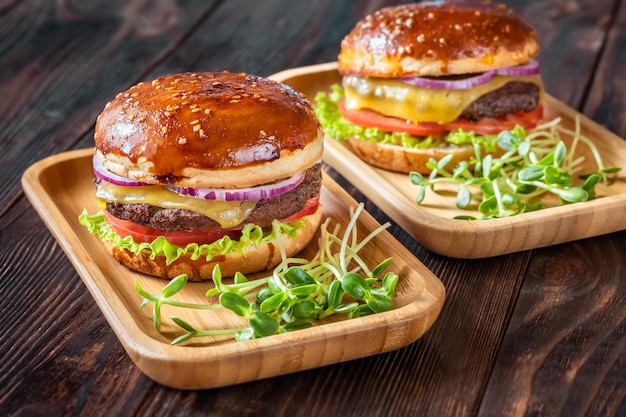 Burgers on the wooden plates