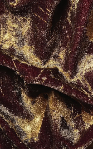 Photo burgundy and gold colored luxurious velvet texture