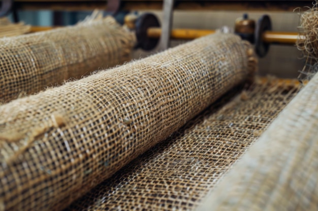 Burlap Fabric Being Processed on an Industrial Machine Textile Manufacturing