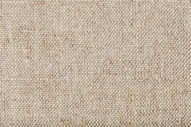 Burlap fabric with linen fibers as background.