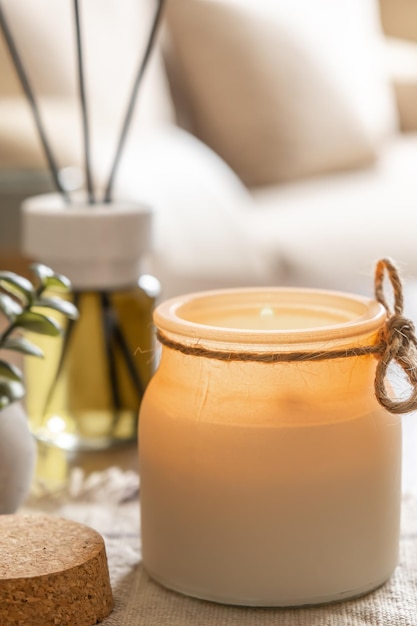 Burning aroma candle and air freshener on table decor elements spa and relax concept free space for text