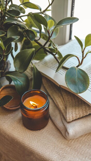 Photo burning candle in a cozy home interior