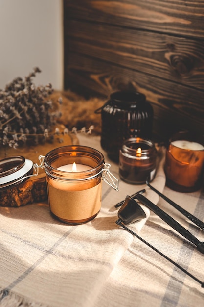 Burning candles and accessories for them atmospheric photo