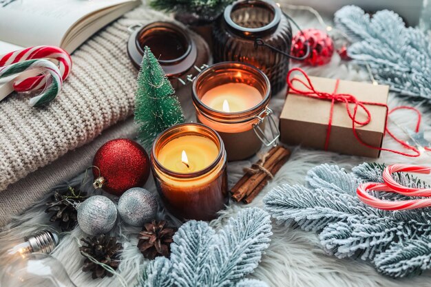 Burning candles in Christmas home interior atmospheric cozy photo