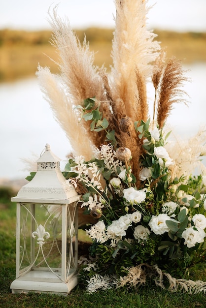 Burning candles on a dark night in a wooden lantern as a decoration for a holiday