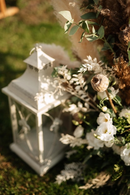 Burning candles on a dark night in a wooden lantern as a decoration for a holiday