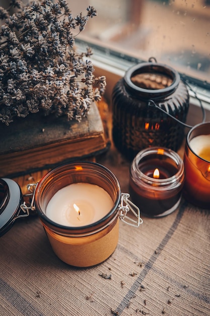 Burning candles on the window autumn atmospheric photo