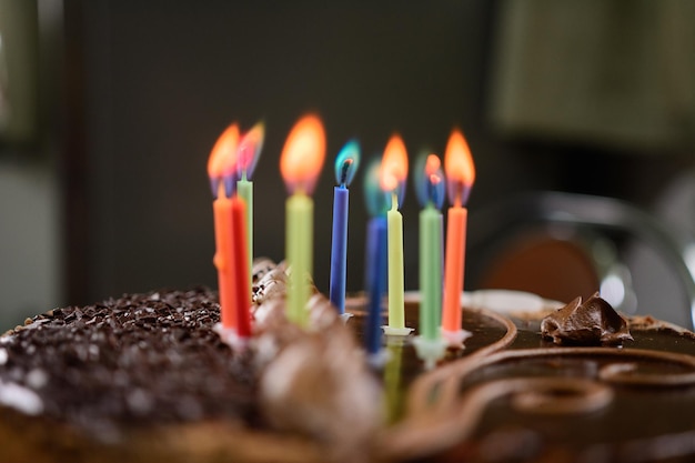 Burning colored candles on a holiday cake the child's tenth anniversary