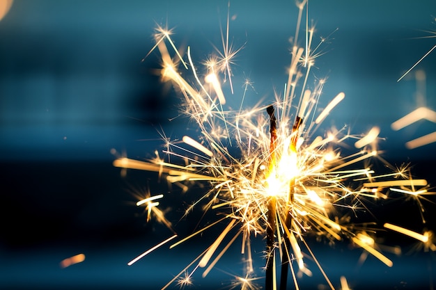 Burning sparklers in night