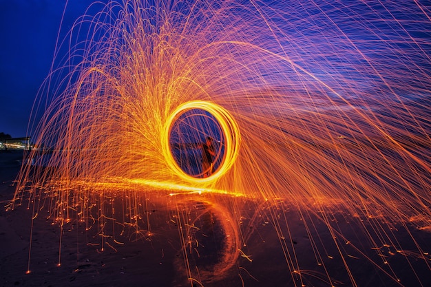 Burning steel wool spinned