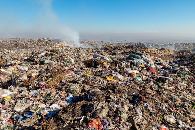 Burning trash piles in landfill