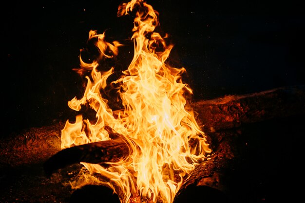 Burning wood at night.