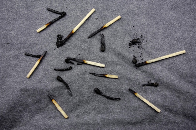 Burnt matches on a dark background Burnt wooden matches