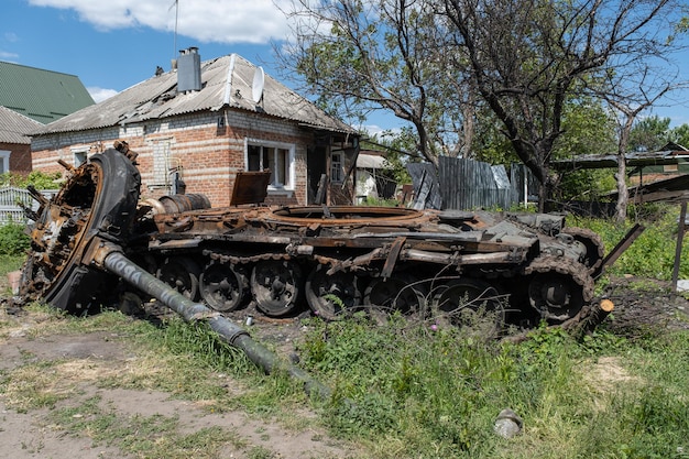 A burnt Russian tank near a residential building War in Ukraine 2022 Russian missiles