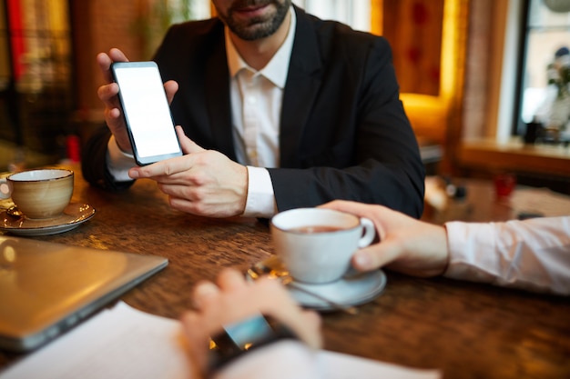 Businesman Presenting Smartphone