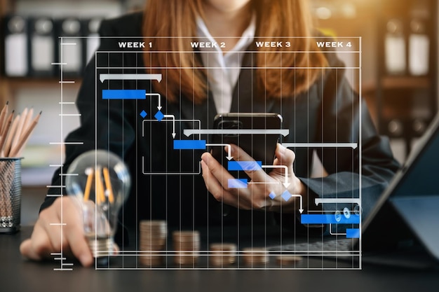 Business accountant working on desk using mobile phone and calculator to calculate budget concept finance and accounting in icon