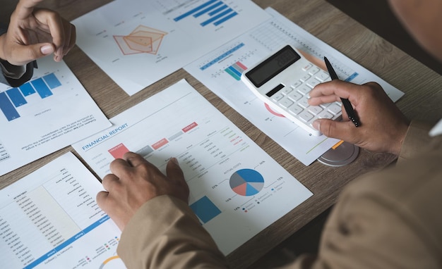 Business adviser meeting to analyze and discuss the situation on the financial report in the meeting roomInvestment Consultant Financial advisor and accounting concept