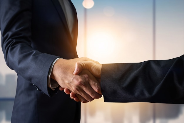 Business agreement and successful negotiation concept, businessman in suit shake hand with customer