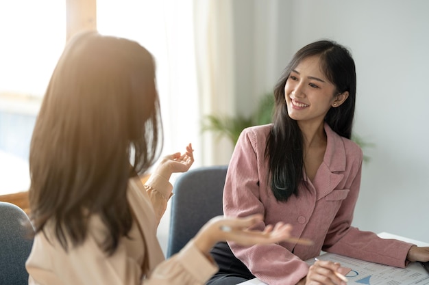 Business asian people discussing talking and smiling during conference in modern office