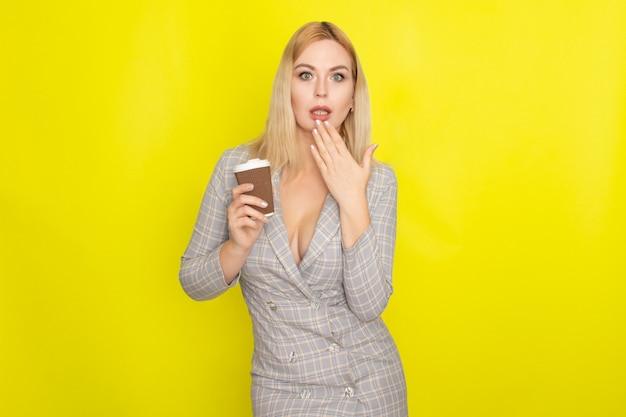 Business blonde woman with cup of coffee