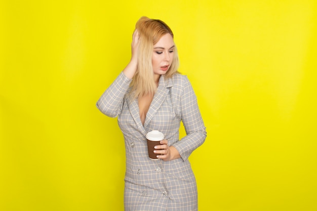 Business blonde woman with cup of coffee