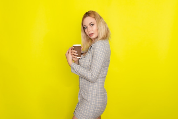 Business blonde woman with cup of coffee