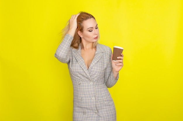 Business blonde woman with cup of coffee